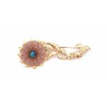 A 14 krt yellow and rose gold flower shaped brooch, set with rose quartz and black opal. Gross