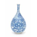 A Chinese blue and white bottle vase, decorated with floral pattern in four linked cartouches.