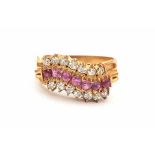 Yellow gold ring set with fourteen old cut diamonds and eight rubies. Ring size: 17/54. Gross