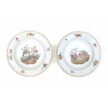 Two German porcelain plates, one decorated with poultry, the other with exotic birds. Marked with