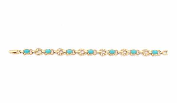 14 carat yellow gold bracelet with imitation stones and seven turquoise coloured paste stones,