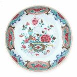 A Chinese famille rose dish, decorated with flowers. The outside with flowers on a lightbrown