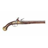 An Italian flintlock pistol, the walnut stock enriched with engraved brass mount. The barrel