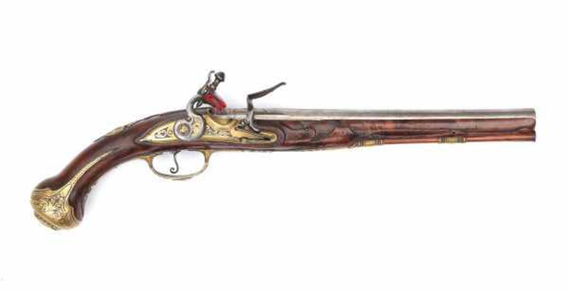 An Italian flintlock pistol, the walnut stock enriched with engraved brass mount. The barrel