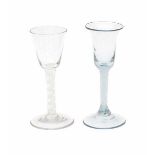 Two English 'twist' wineglasses, with double white spiral. 18th century.height 16 cm.- - -29.00 %
