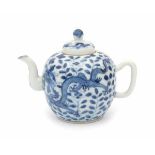 A Chinese blue and white teapot, decorated with two dragons amidst flowers. Marked with a four