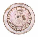 A Hispano-Moresque plate, decorated with a standing bird of prey in luster glaze. 17th