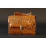 Python evening bag, wear and tear, dim. 14 x 20 cm. 27.00 % buyer's premium on the hammer price,