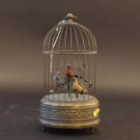 Musical box with moving bird, mid 20th century, functions, h. 28 cm. 27.00 % buyer's premium on the