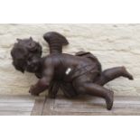 Wooden putto, Germany, 18th century, some damage, l. 64 cm. 27.00 % buyer's premium on the hammer