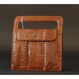 Snakeskin handbag, brown, wear and tear, dim. 23 x 22 cm. 27.00 % buyer's premium on the hammer