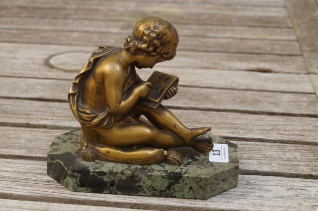 Gilt bronze sculpture on marble base, early 20th century, Young man with book, dim. 10 x 10 cm.