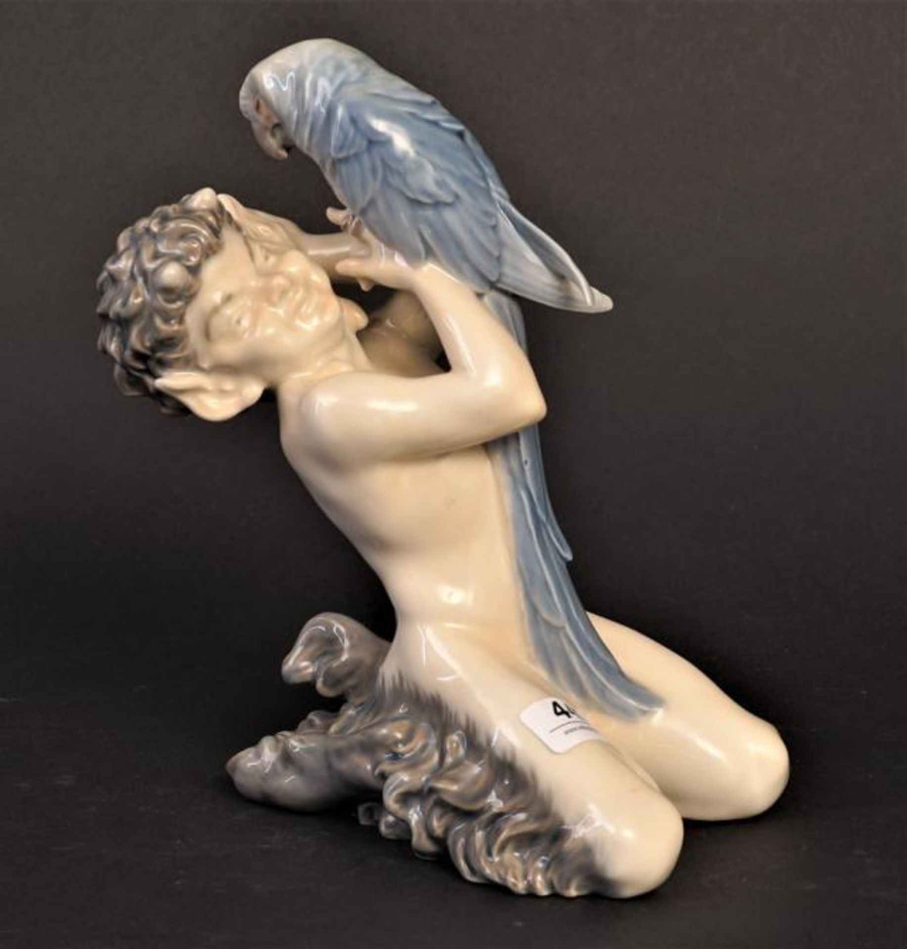 Porcelain Royal Copenhagen figure, Faun with parrot, h. 12 cm.