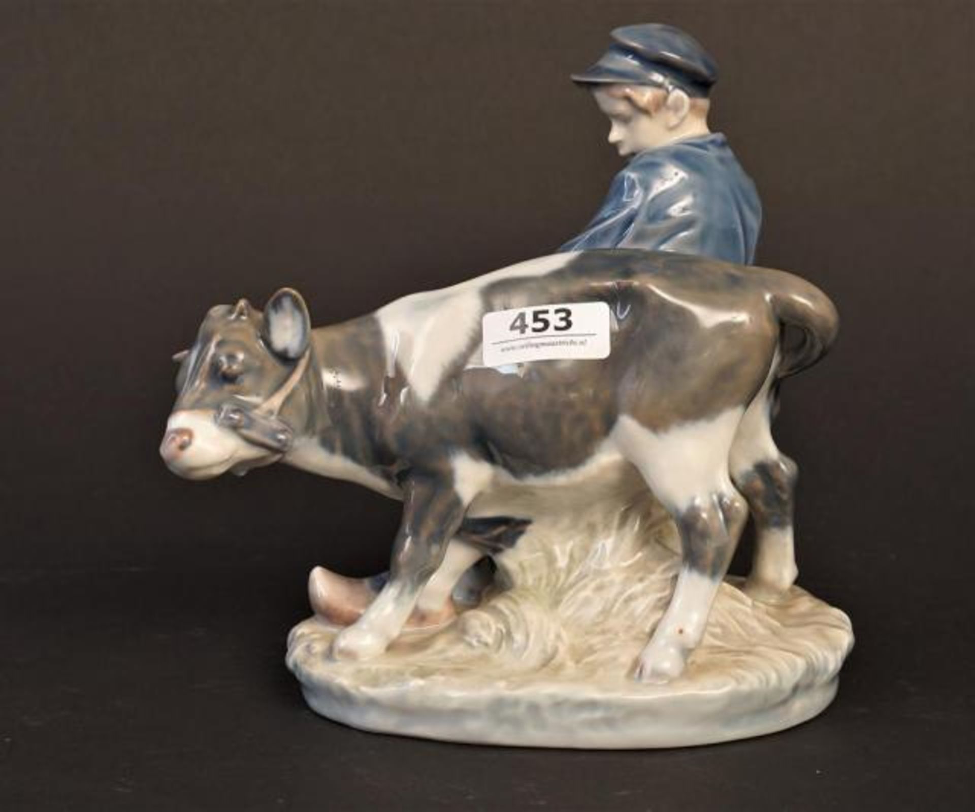 Porcelain Royal Copenhagen figure, Boy with calf, h. 18 cm.