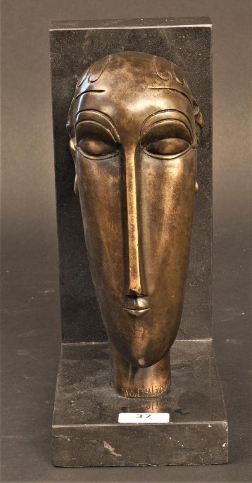 Bronze sculpture on marble base, Head/book support after Brancusi, h. 24 cm.