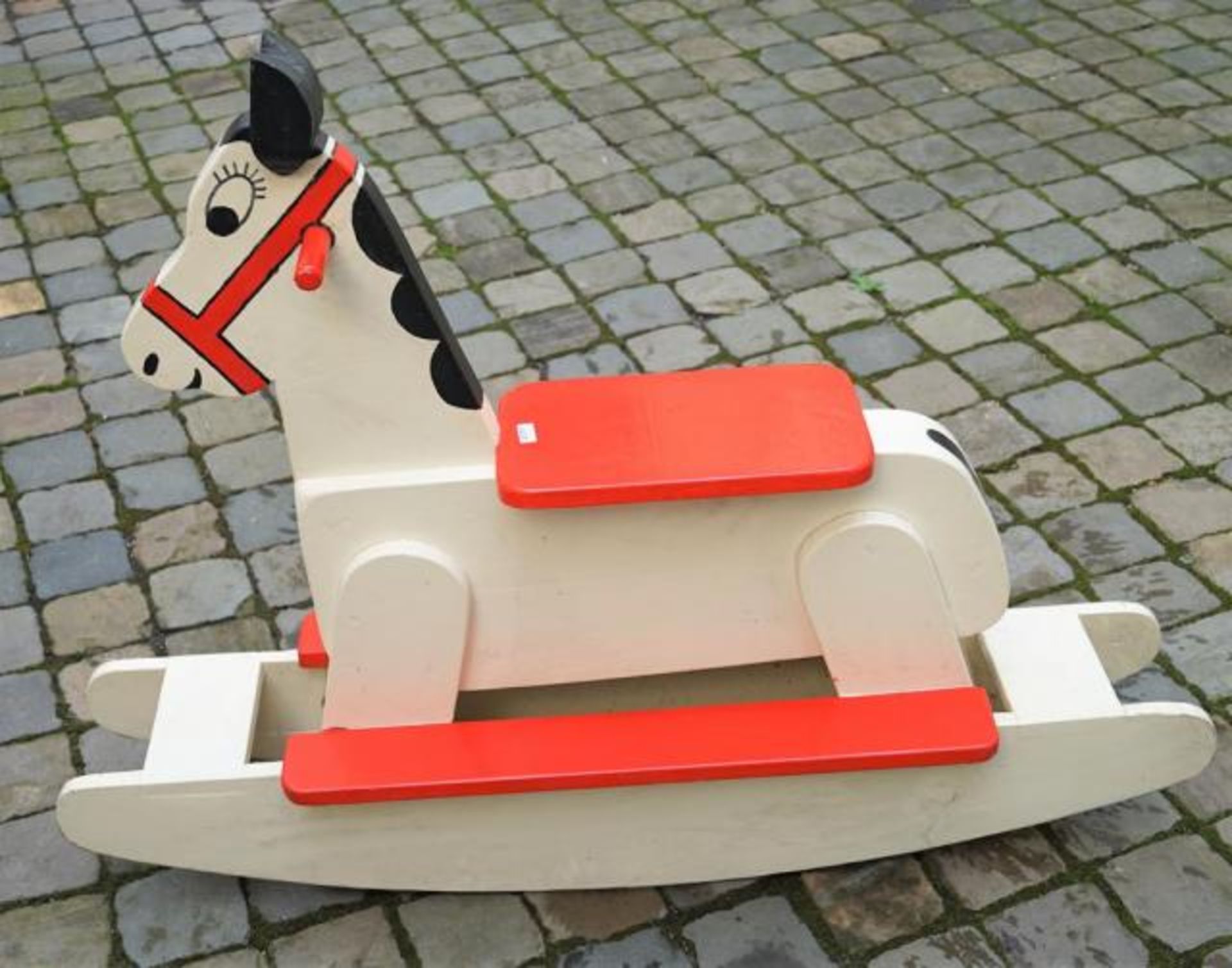 Wooden painted rocking horse, dim. 84 x 110 cm.