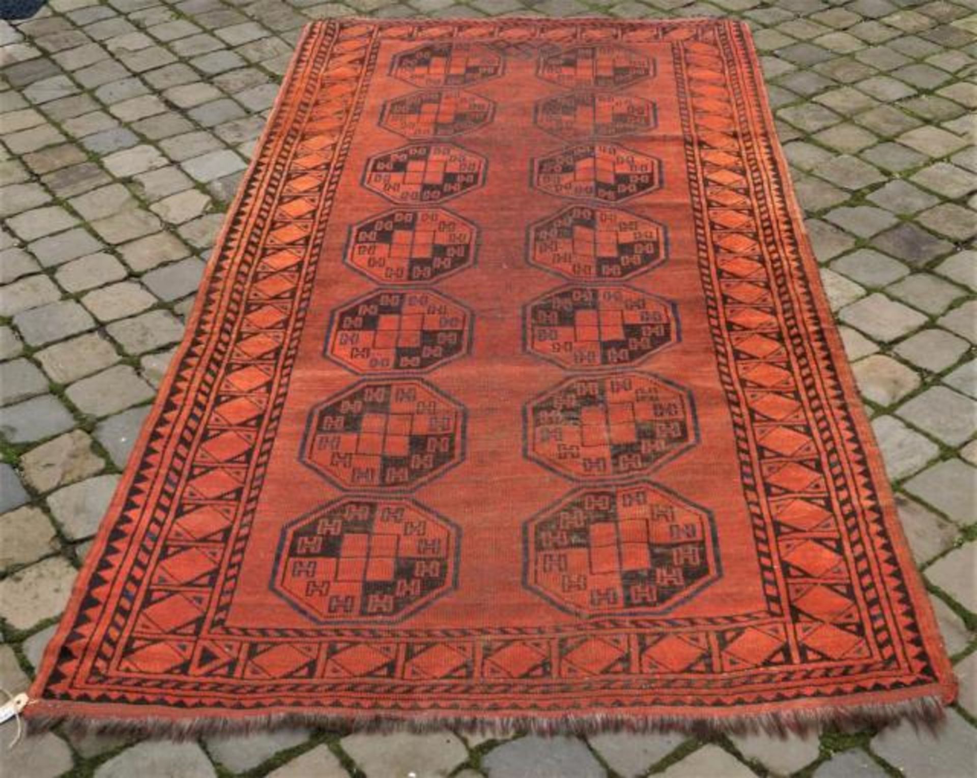 Afghan carpet, dim. 230 x 120 cm, wear and tear and some damage