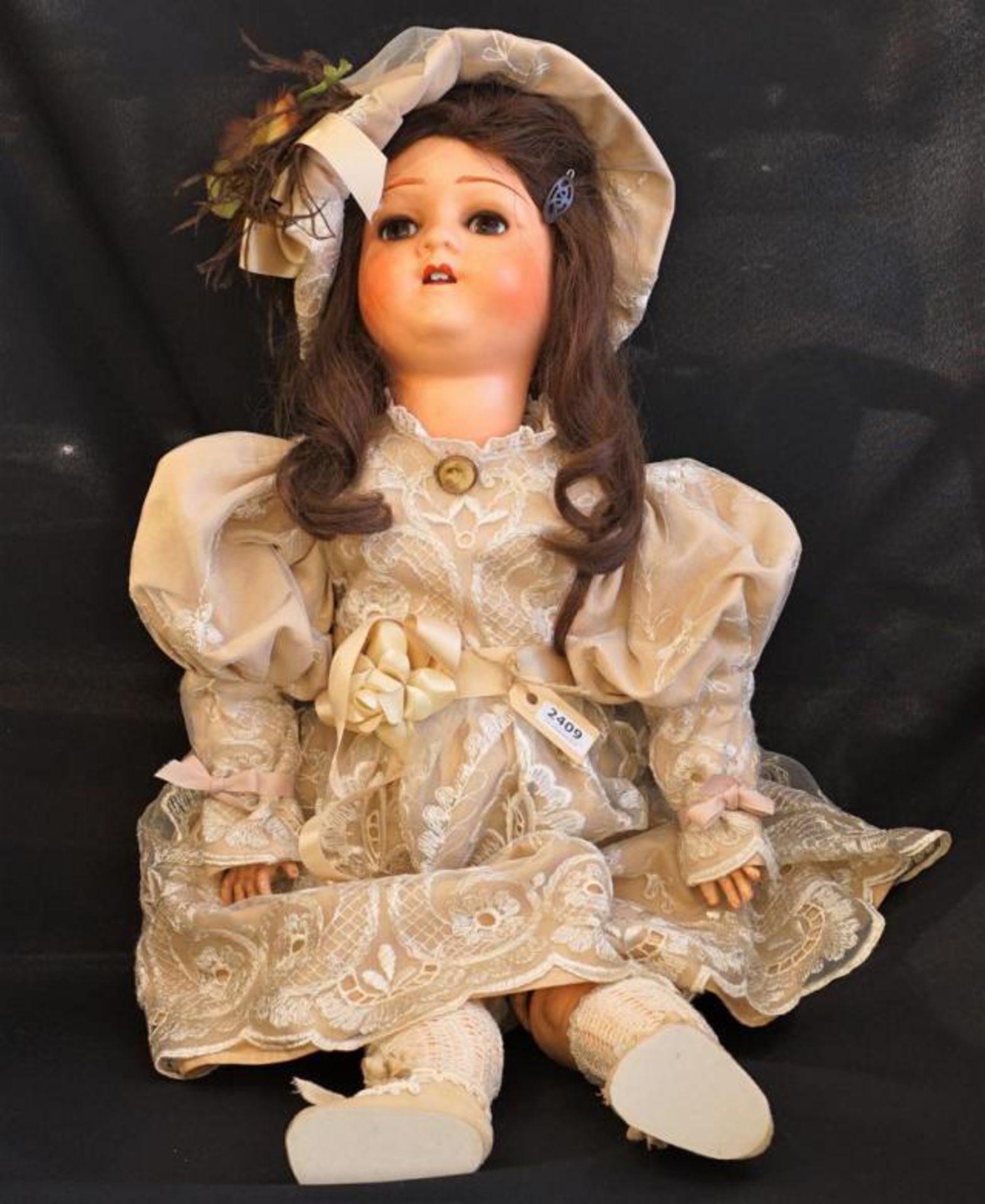 Papier-maché doll with sleep eyes and open mouth, l. 72 cm.<