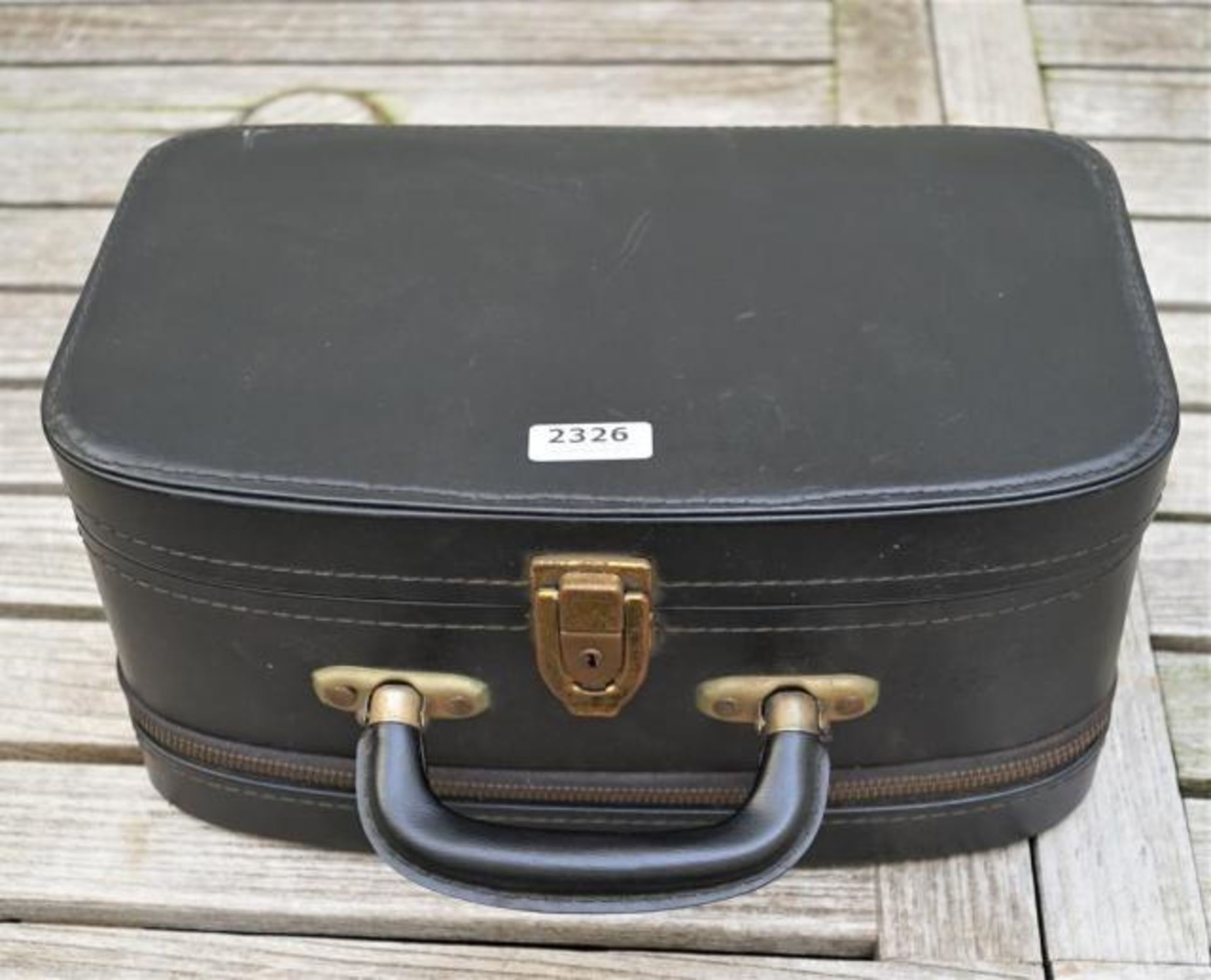 Leather travel suitcase with content