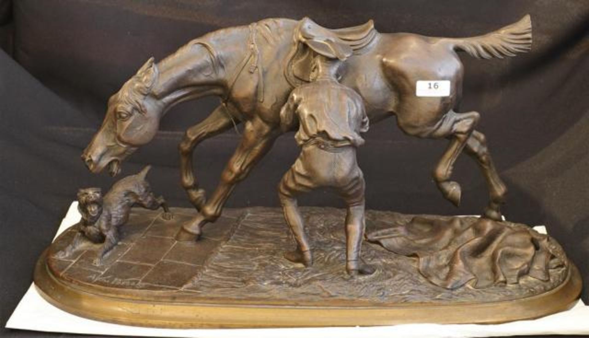 A. du Passage (1838-1909), bronze sculpture, Horseman sadling a horse, dim. 22 x 52 x 20 cm.