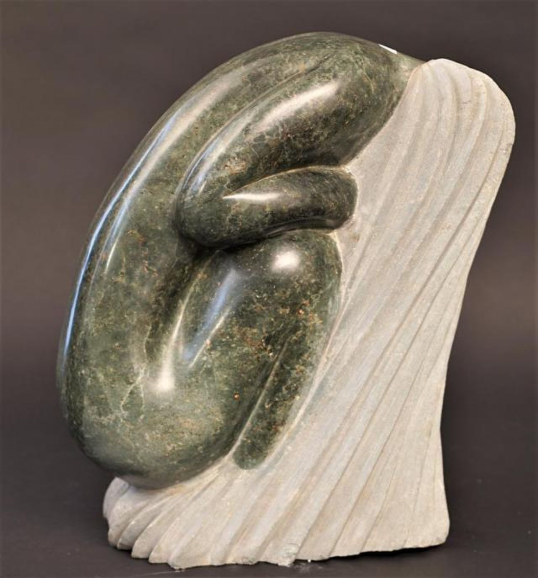 African stone sculpture, bending woman, h. 38 cm.