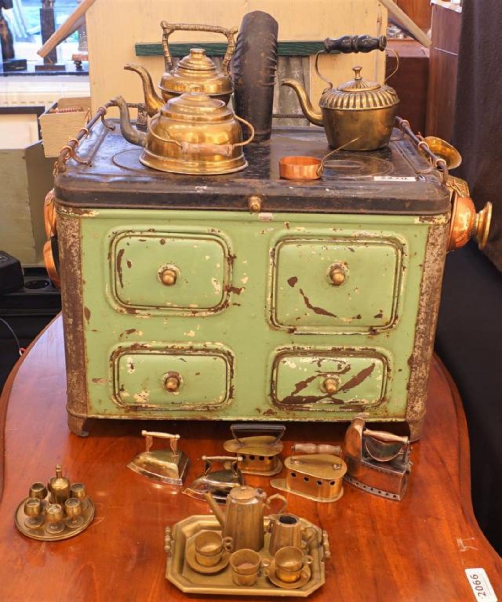 Tin toy stove with attributes, twenties, dim. 33 x 30 x 21 cm.