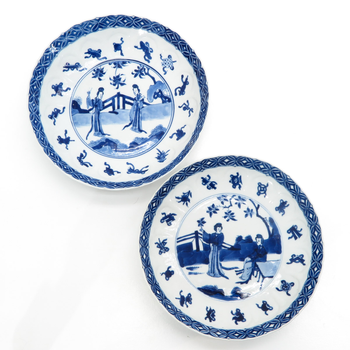 A Pair of Blue and White Decor Plates