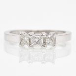 A 10KWG Diamond Ring with Three Princess Cut Diamonds