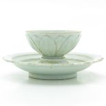 A Celadon Cup and Saucer