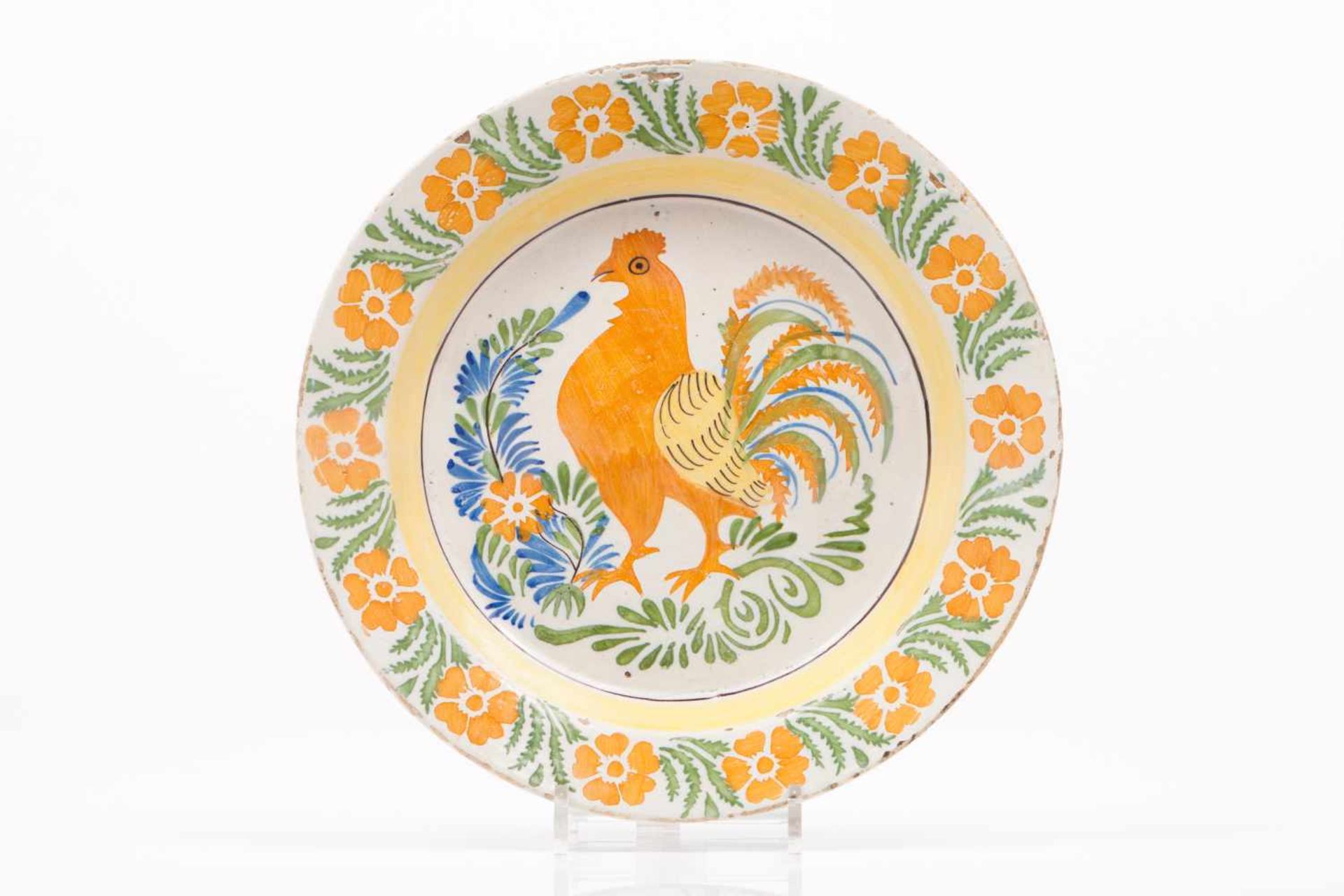 A platePortuguese faience, possibly Fervença or BandeiraPolychrome decoration depicting rooster at