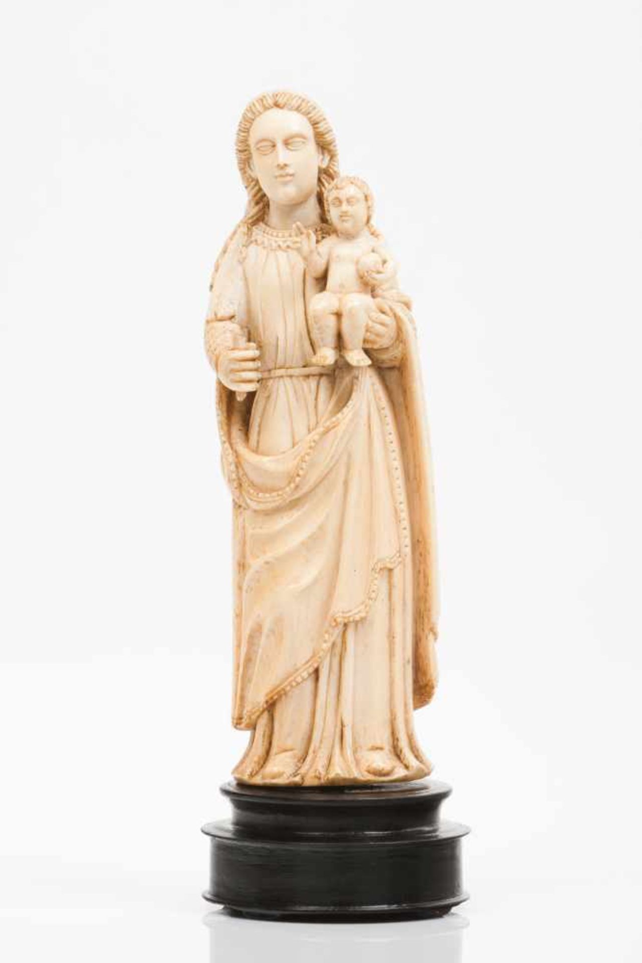 Our Lady with the ChildIvory Indo-Portuguese sculptureEbonized wood base18th century(small losses