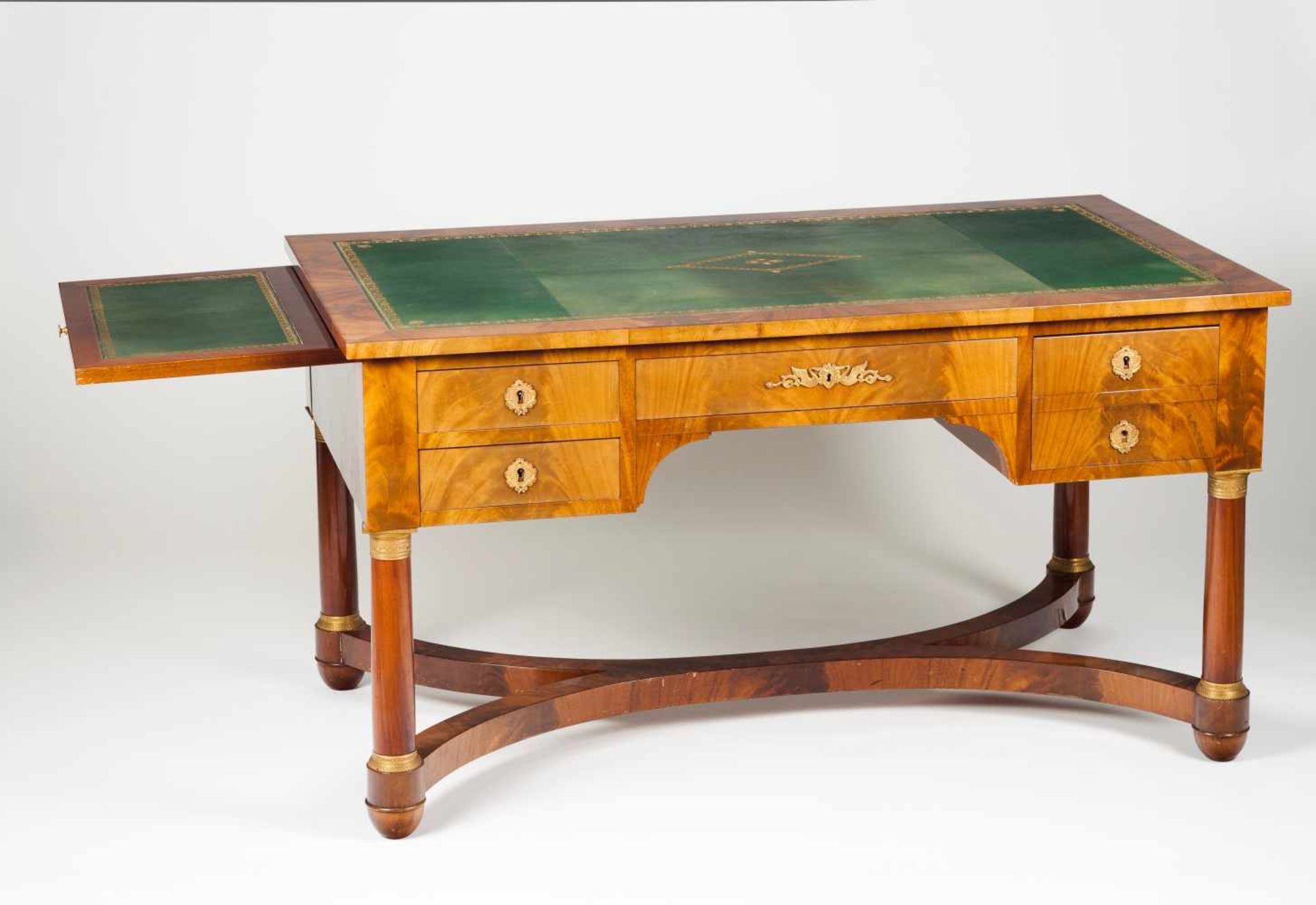 An Empire style bureau platMahoganyGilt bronze mountsGreen leather lined topWith four drawers of