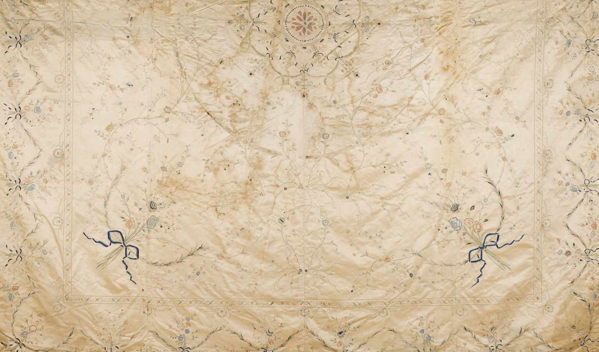 A coverletPolychrome and gilt silk embroided silk representing flowers and ribbonsChina, late
