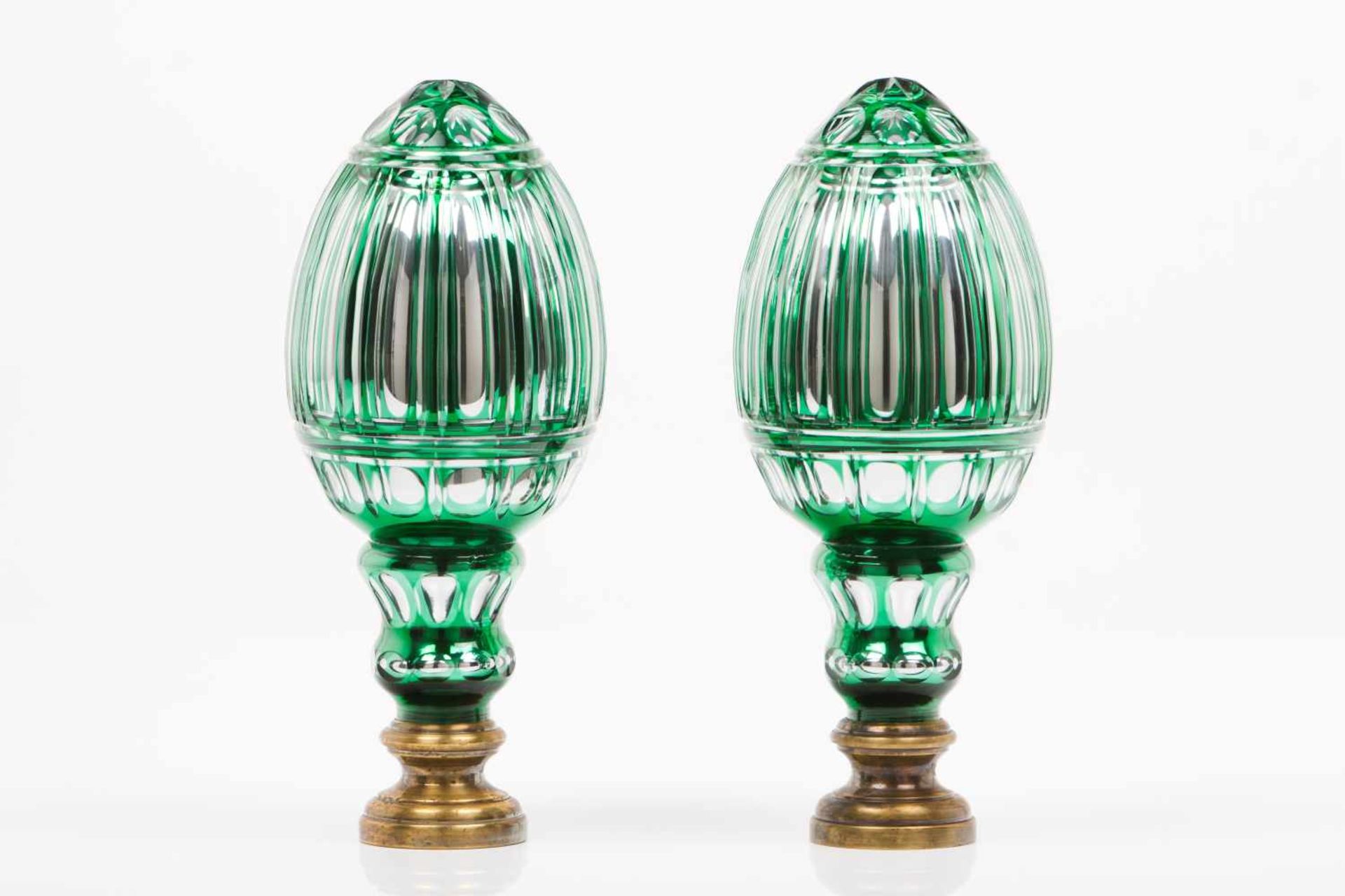 A pair of handrail finialsGreen and colorless glassMirror glassMolded and cut decorationBrass