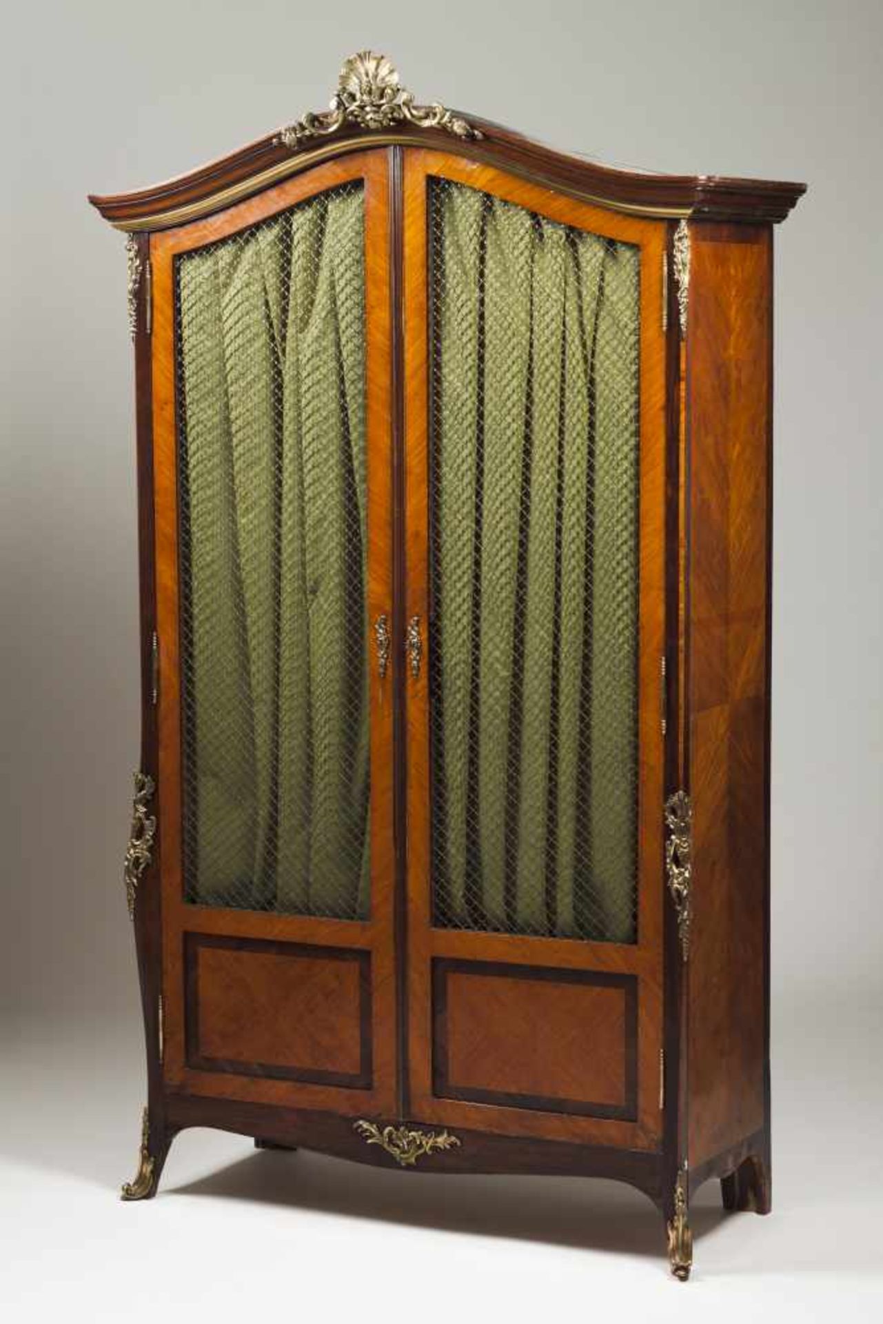 A Napoleon III bookcaseRosewoodTwo doors with metallic net doorsInterior with shelvesGilt bronze