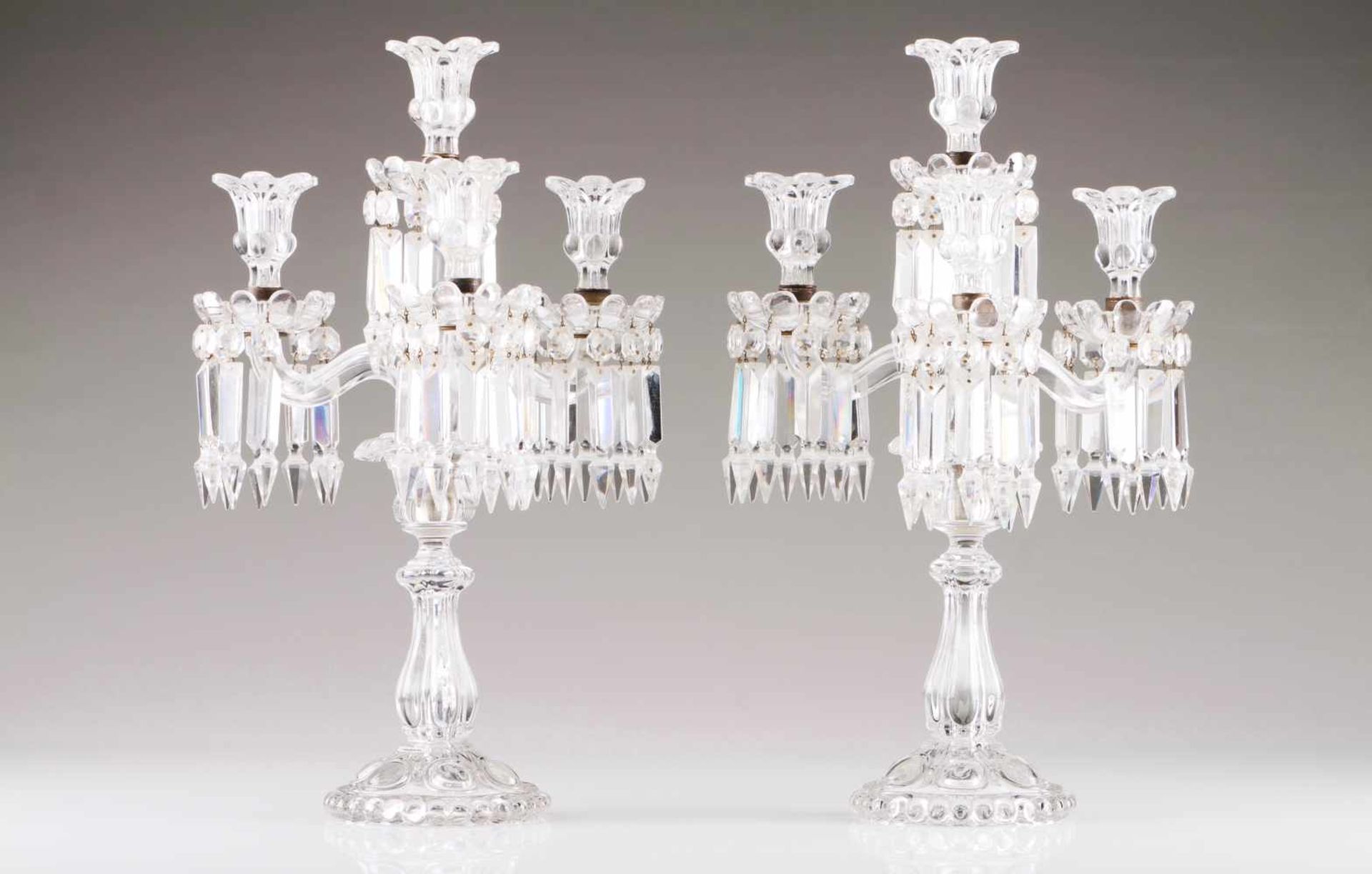 A pair of four-light candelabraCut-crystalMolded decorationMarked BaccaratHeight: 47 cm