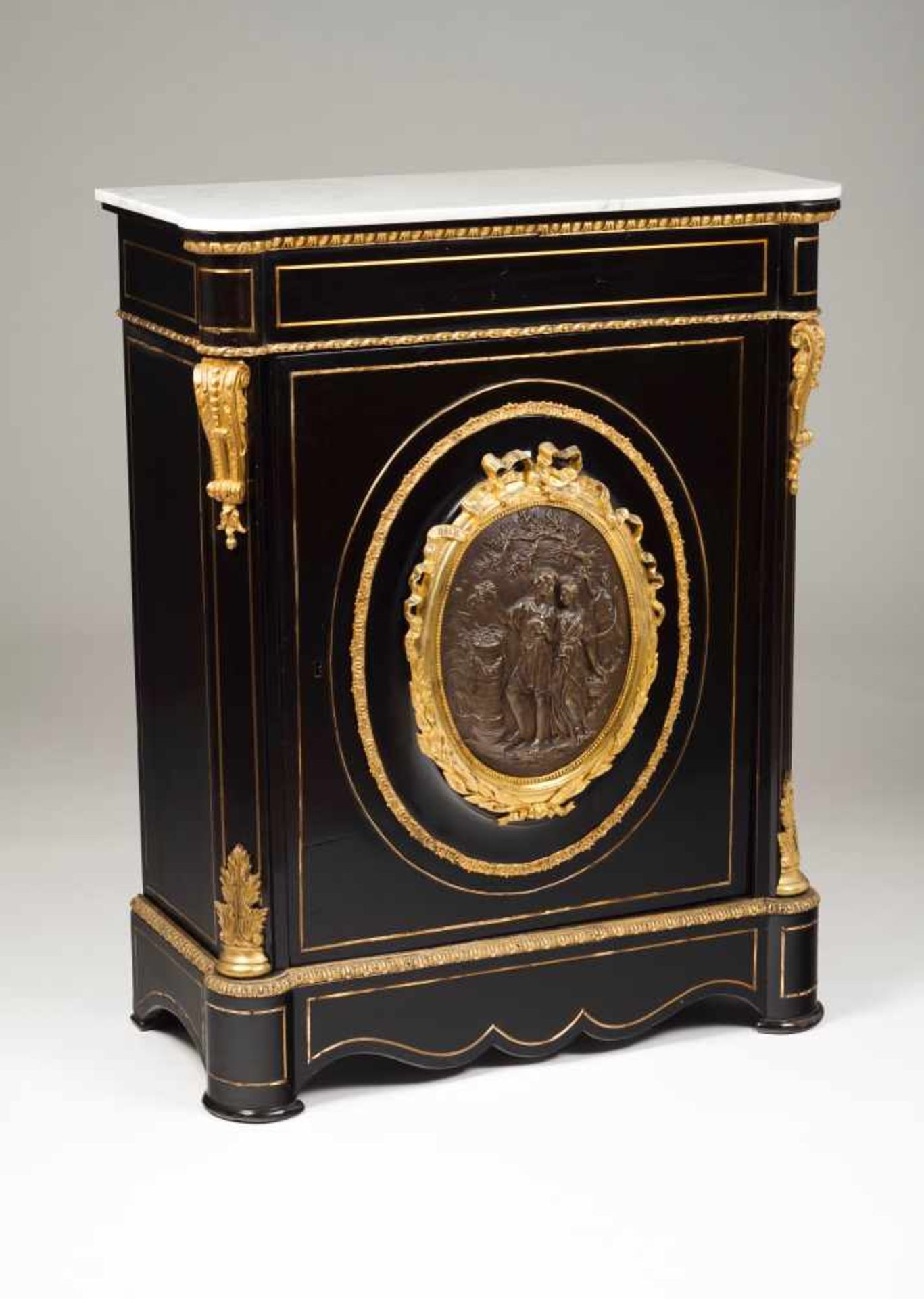 A Napoleon III cabinetEbonized woodGilt metal mounts decorated in relief, centre with bronze