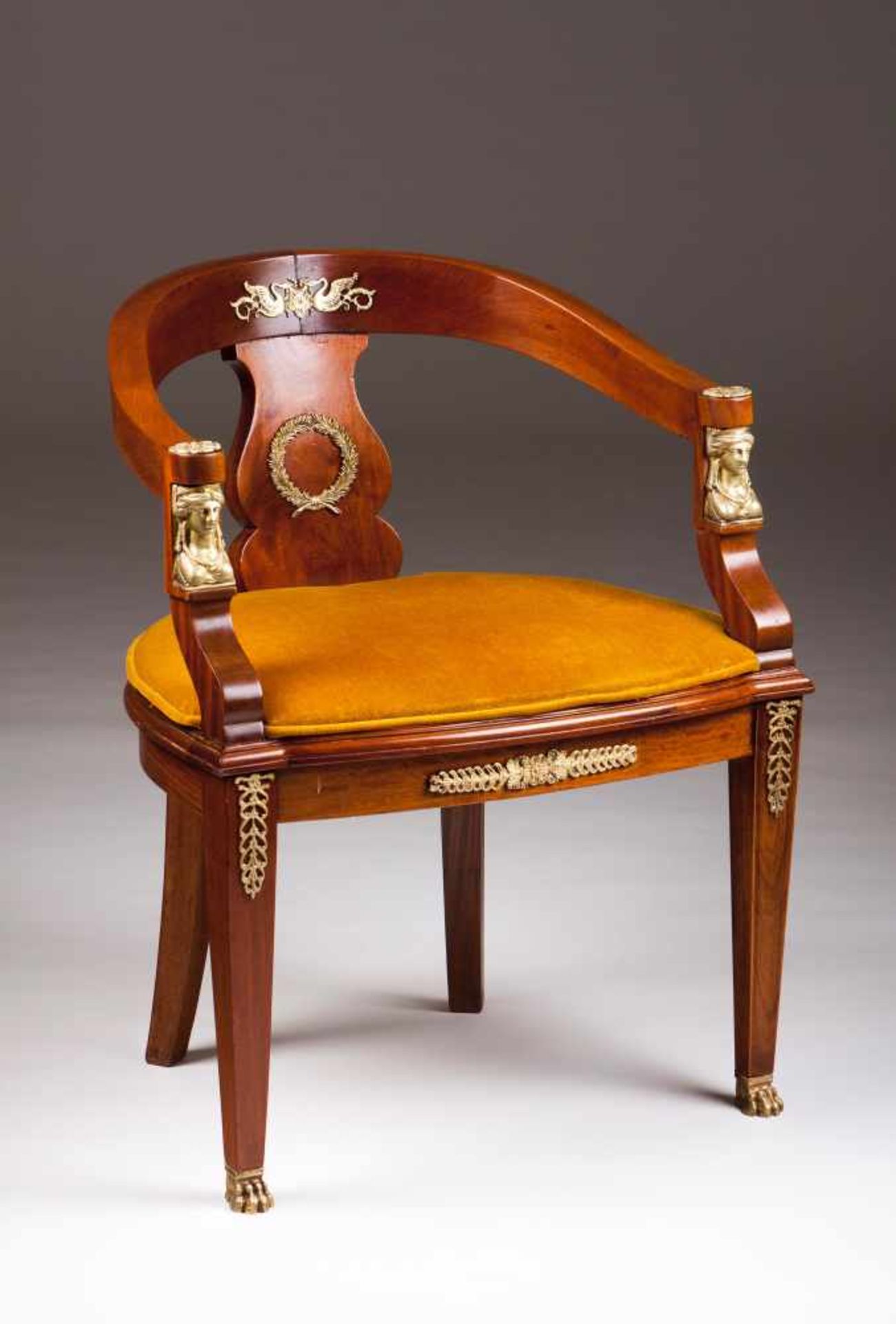 An Empire style fauteuilMahoganyBrass mountsYellow velvet upholstered seatFrance, 20th century