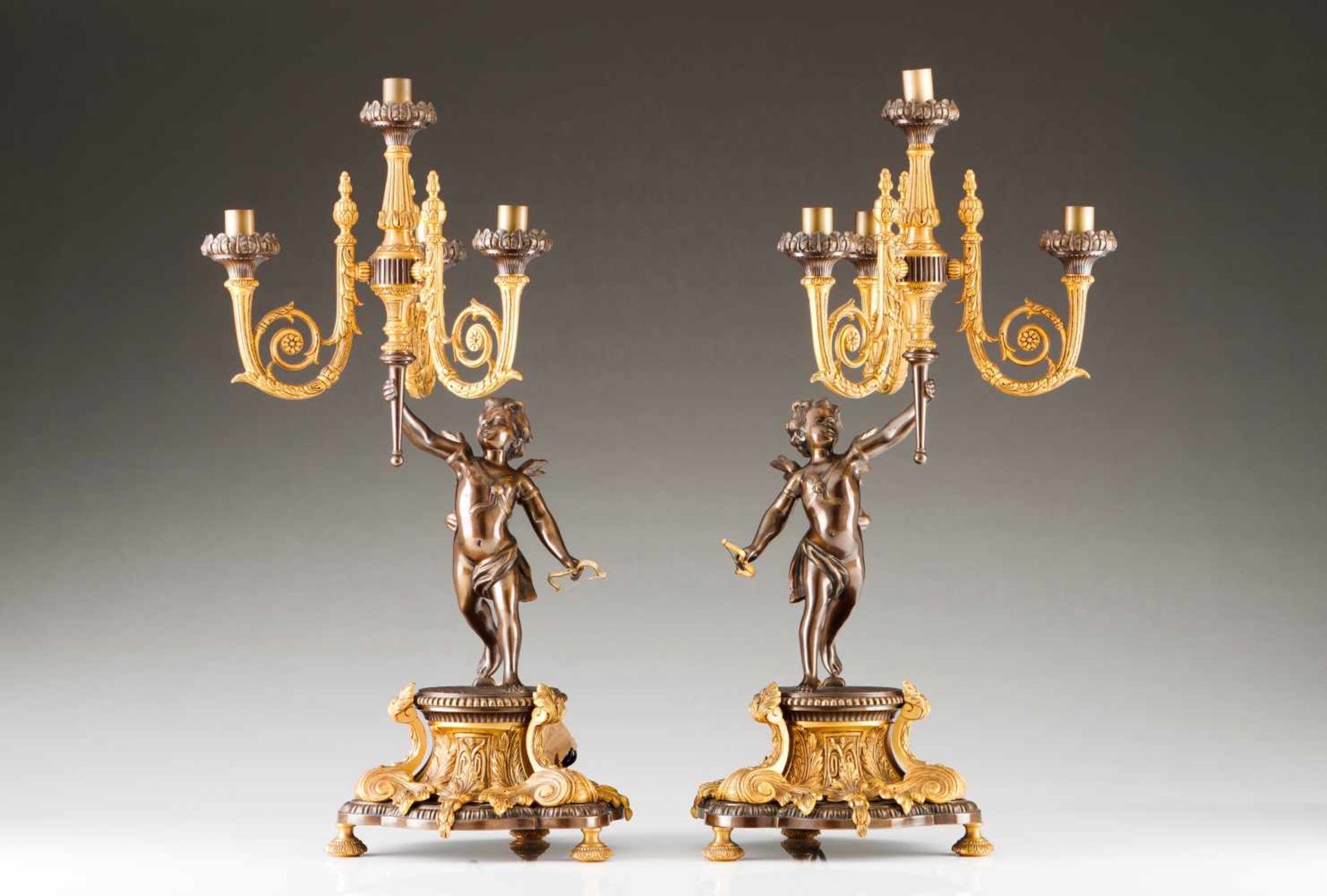 A pair of three-branch candelabraGilt bronzeRaised decoration with CupidsFrance, 19th C.Hight.: 70