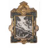 A Barroque frameCarved, gilt and marbled woodWith a print of a reclined Baby Jesus encircled by