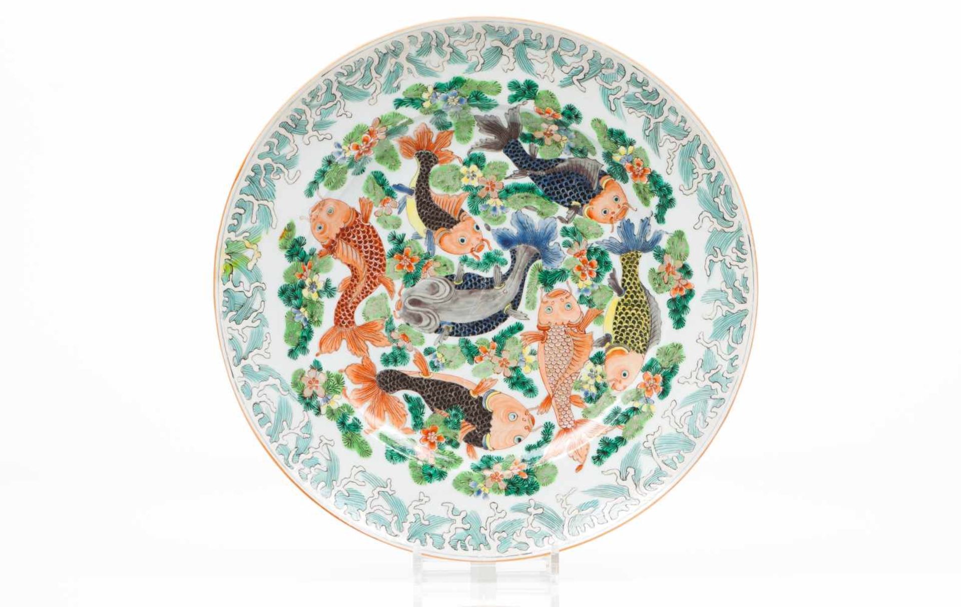 A large plateChinese porcelainPolychrome decoration with carps and foliage scroll motifs19th /