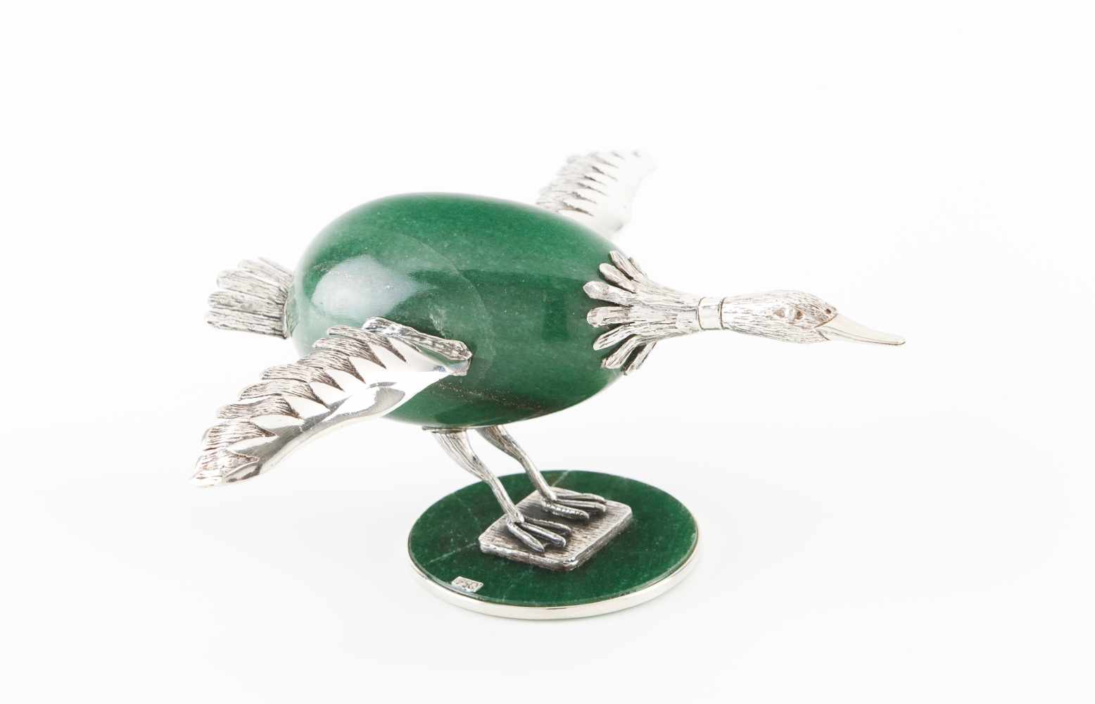 A flying birdPossibly South American silver. Scalloped and chiselled decoration with