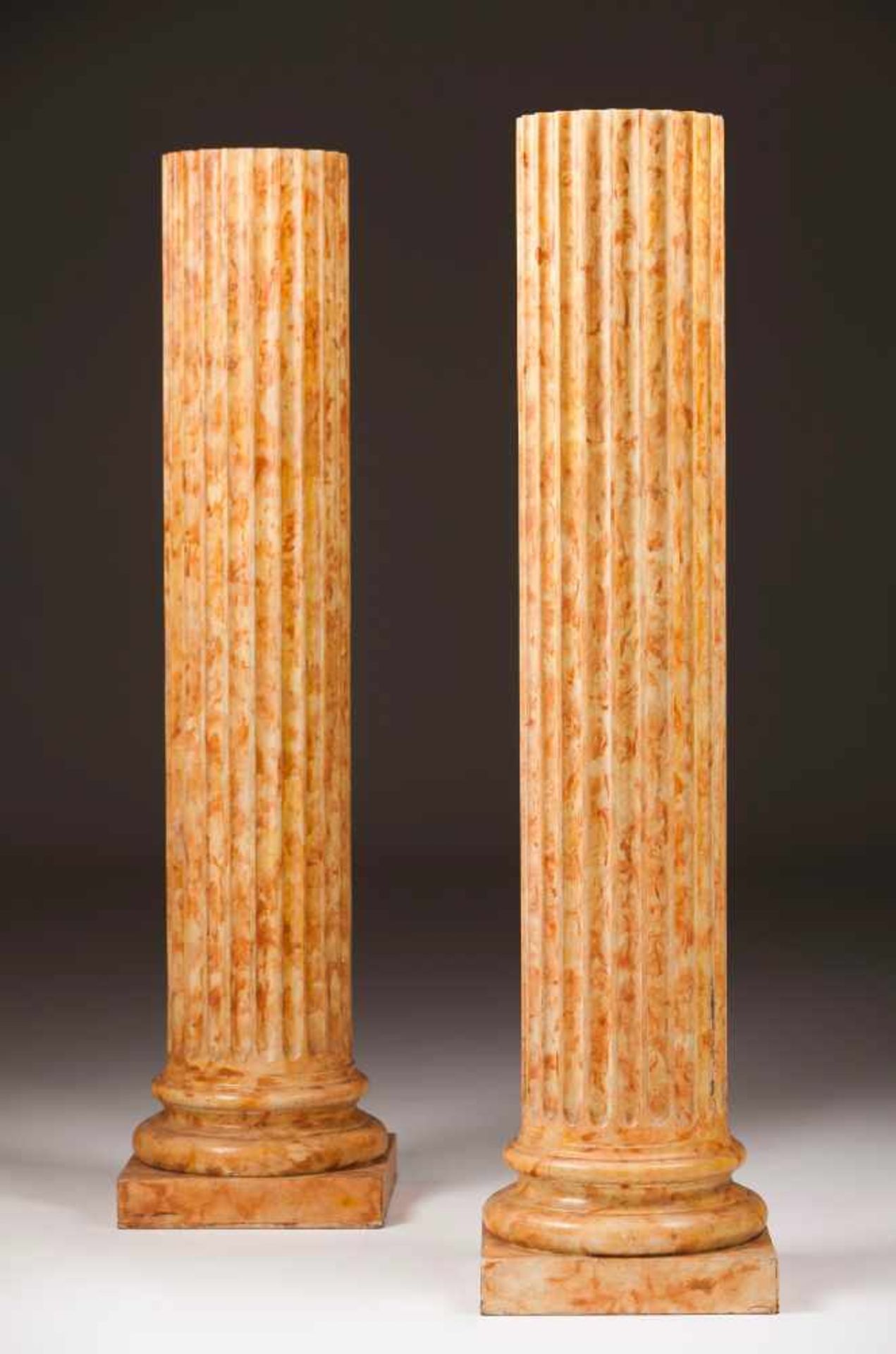 A pair of classical columnsPainted woodCarved and marbled decorationFundação Ricardo Espírito