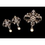 A brooch and earringsGold and silver. Bows set with small rose cut diamonds and pearl pendantsOporto