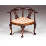 A corner ChairCarved mahoganyThe back with two splats and cabriole legsDrop-in seat covered in