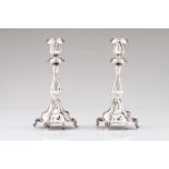 A pair of candlesticksPortuguese silverFluted and scalloped decoration, on four claw feetPorto assay