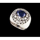 A ringA white gold "Belle-Époque" applied element, set with, possibly, a Ceylon sapphire (ca.3.