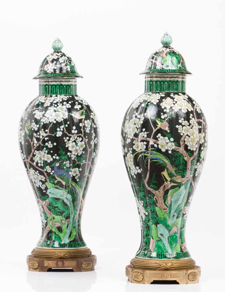 A pair of lided potsChinese export porcelainPolychrome "Famille Noir" enamels decoration with