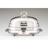 A large entrée dishCheffield plat Oval base with gadrooned frieze and turned handles, on 4 claw