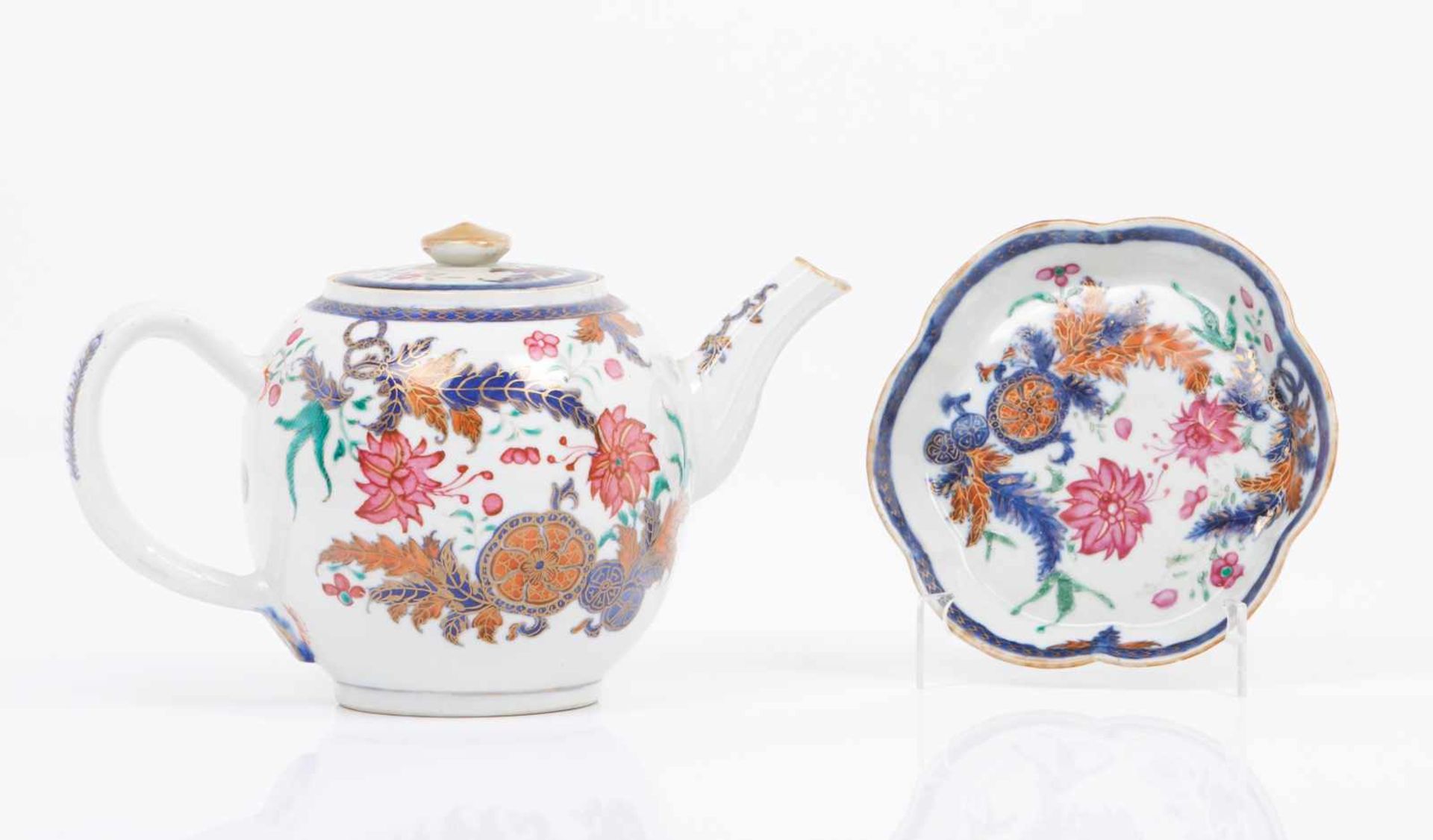 A teapot and saucerChinese export porcelainPolychrome "Famille Rose"enamels decoration said "